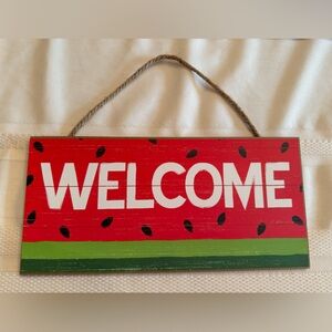 Red and Green Welcome Sign